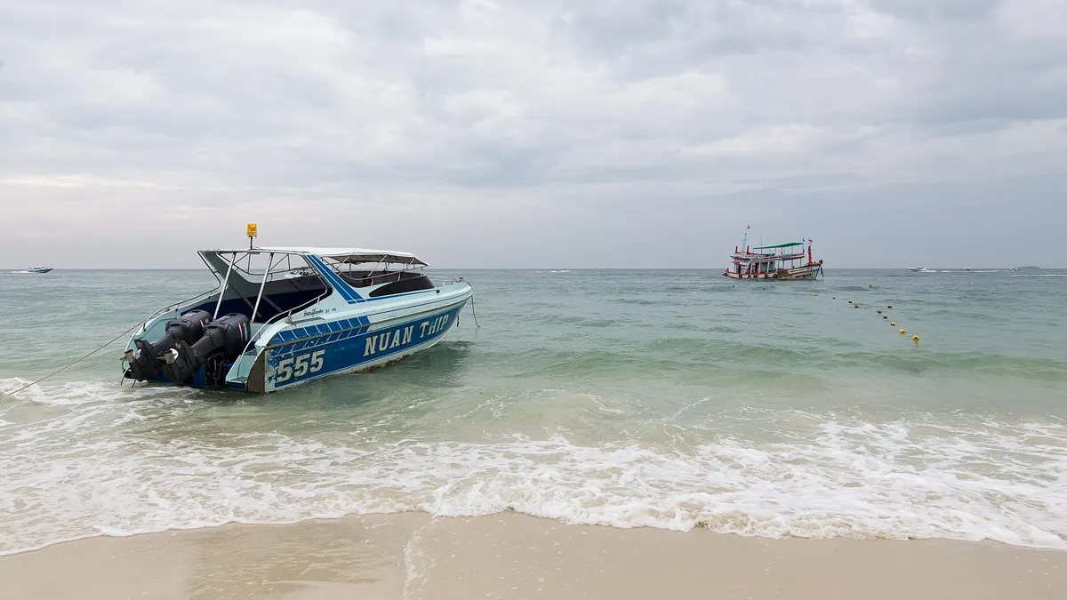 A Nuanthip speedboat pulled up on a Koh Samet beach